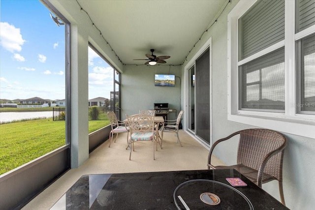 13338 Waterleaf Garden Cir, Riverview, FL 33579 - sunroom with ceiling fan and a water view