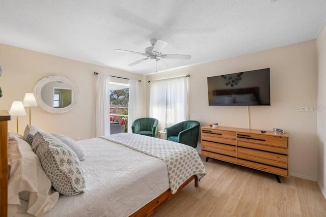 4731 Egret Rd, Venice, FL 34293 - bedroom with baseboards, wood finished floors, ceiling fan, and a textured ceiling