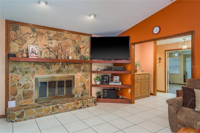 18216 Monteverde Dr, Spring Hill, FL 34610 - living area featuring a textured ceiling, light tile patterned flooring, and a stone fireplace