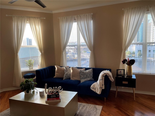 living room with plenty of natural light and ornamental molding