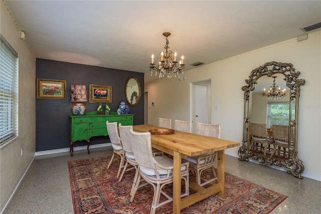 dining room with baseboards, speckled floor, a notable chandelier, and visible vents