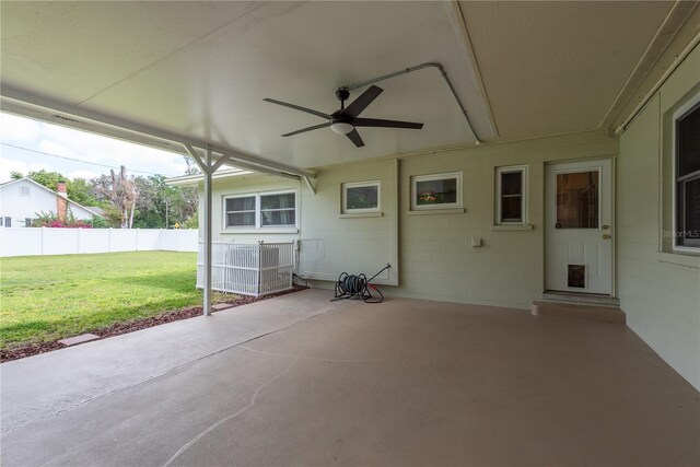 view of patio featuring ceiling fan and fence
