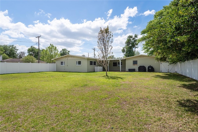 view of yard featuring a fenced backyard and cooling unit
