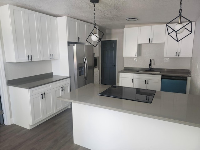 825 Lincoln Ave, Tarpon Springs, FL 34689 - kitchen with a sink, a textured ceiling, white cabinetry, stainless steel fridge with ice dispenser, and dishwasher
