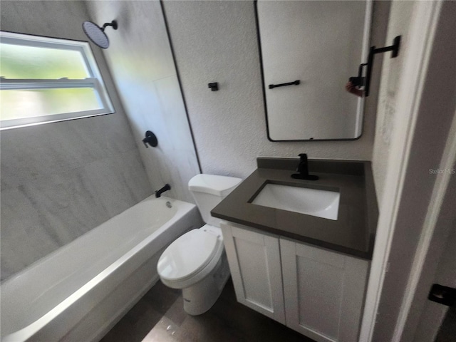 825 Lincoln Ave, Tarpon Springs, FL 34689 - bathroom with toilet, a textured wall, vanity, and bathing tub / shower combination