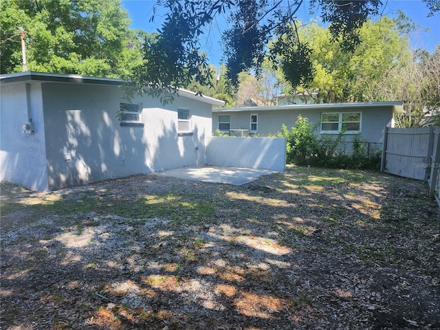 825 Lincoln Ave, Tarpon Springs, FL 34689 - view of yard featuring fence and a patio