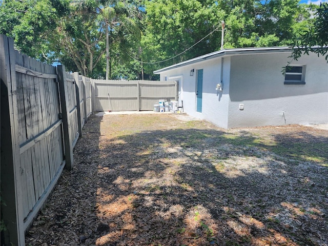 825 Lincoln Ave, Tarpon Springs, FL 34689 - view of yard featuring a fenced backyard