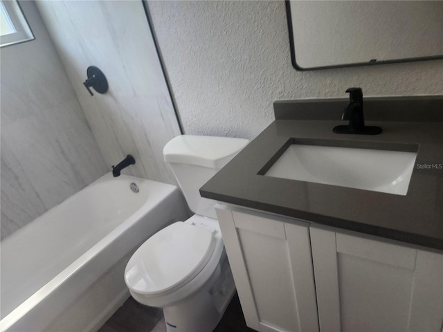 825 Lincoln Ave, Tarpon Springs, FL 34689 - bathroom with a textured wall, toilet, and vanity