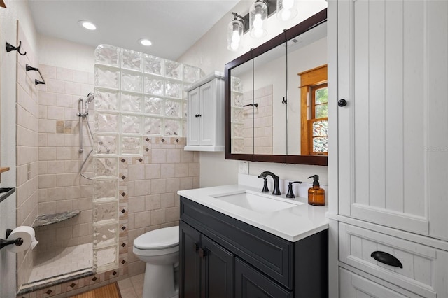 full bathroom featuring walk in shower, toilet, recessed lighting, vanity, and tile patterned floors