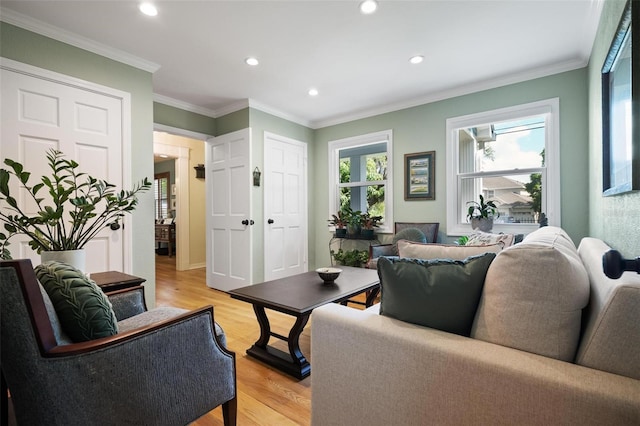 living area featuring crown molding, recessed lighting, and light wood-style floors