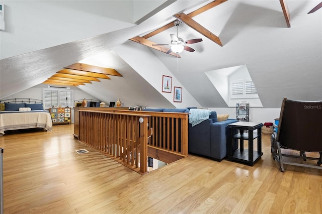 bedroom featuring vaulted ceiling and wood finished floors
