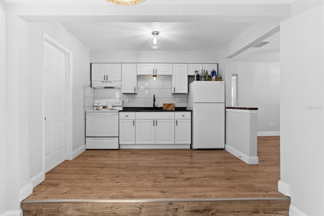 1309 45th St S, Saint Petersburg, FL 33711 - kitchen featuring visible vents, white cabinetry, white appliances, and under cabinet range hood
