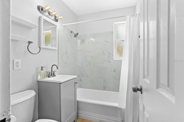 1309 45th St S, Saint Petersburg, FL 33711 - full bathroom featuring shower / bath combo, plenty of natural light, vanity, and toilet