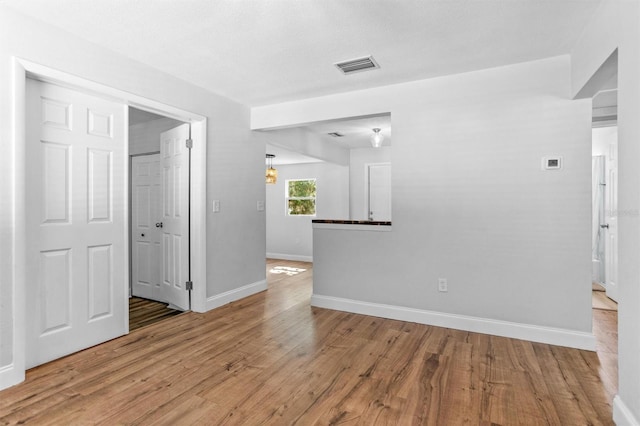 1309 45th St S, Saint Petersburg, FL 33711 - spare room featuring visible vents, baseboards, and light wood-style flooring