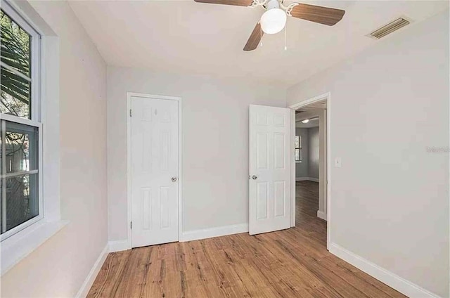 1309 45th St S, Saint Petersburg, FL 33711 - unfurnished bedroom featuring wood finished floors, baseboards, and visible vents