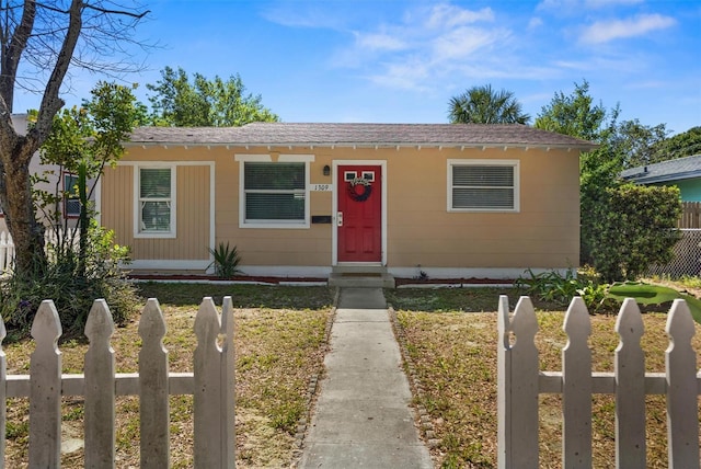 1309 45th St S, Saint Petersburg, FL 33711 - bungalow-style home featuring fence and a shingled roof