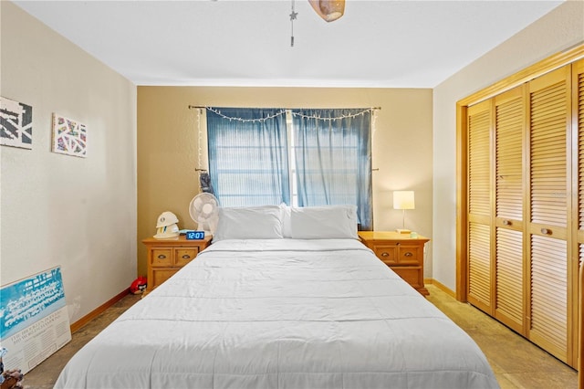 bedroom featuring a closet and baseboards