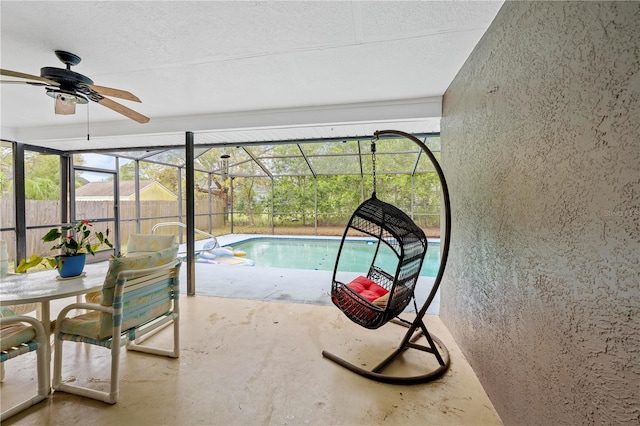 view of pool with ceiling fan and a fenced in pool
