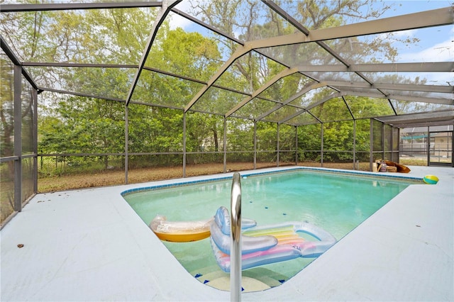 outdoor pool featuring a lanai and a patio