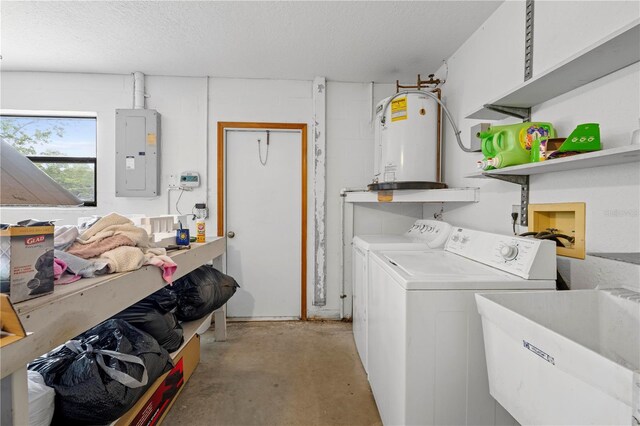 clothes washing area featuring electric panel, a sink, laundry area, independent washer and dryer, and water heater