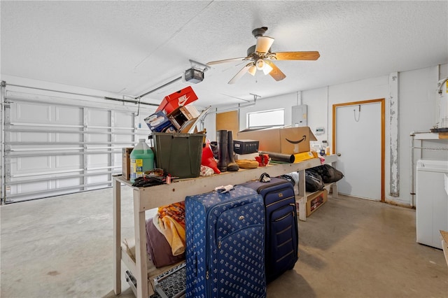 garage featuring ceiling fan, washer / dryer, a garage door opener, and electric panel