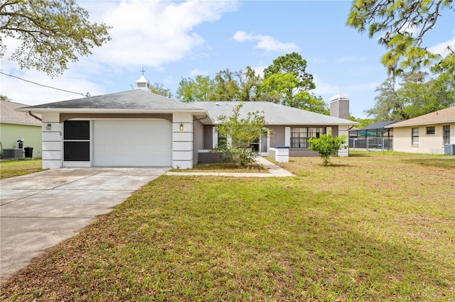 ranch-style home with concrete driveway, a front yard, central air condition unit, and an attached garage