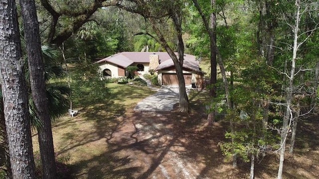exterior space featuring a view of trees