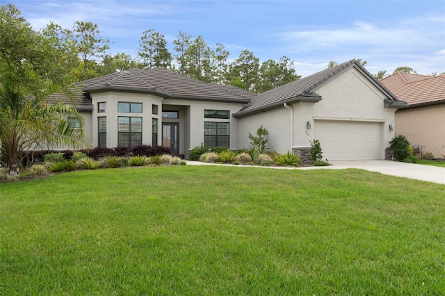 877 N Hunt Club Dr, Hernando, FL 34442 - view of front of house featuring a garage, a front yard, concrete driveway, and a tile roof