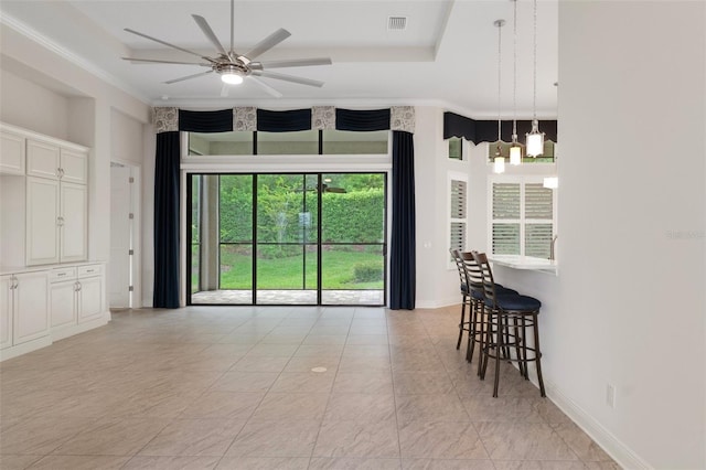 877 N Hunt Club Dr, Hernando, FL 34442 - interior space featuring visible vents, a tray ceiling, baseboards, and ceiling fan