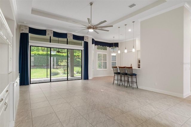 877 N Hunt Club Dr, Hernando, FL 34442 - living room with visible vents, baseboards, a ceiling fan, and a raised ceiling