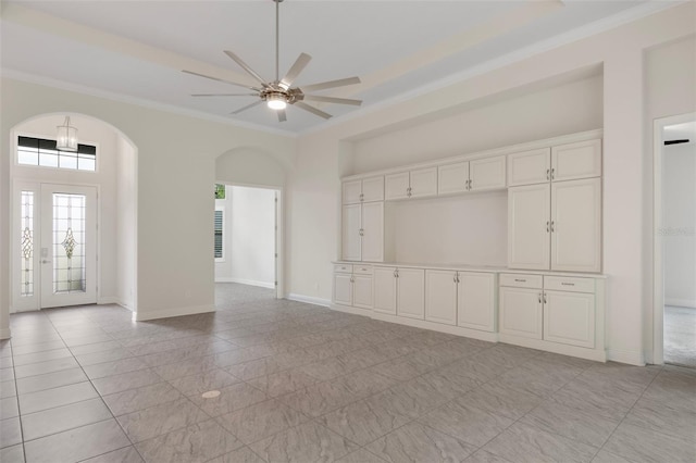 877 N Hunt Club Dr, Hernando, FL 34442 - unfurnished living room with arched walkways, ceiling fan, baseboards, and ornamental molding
