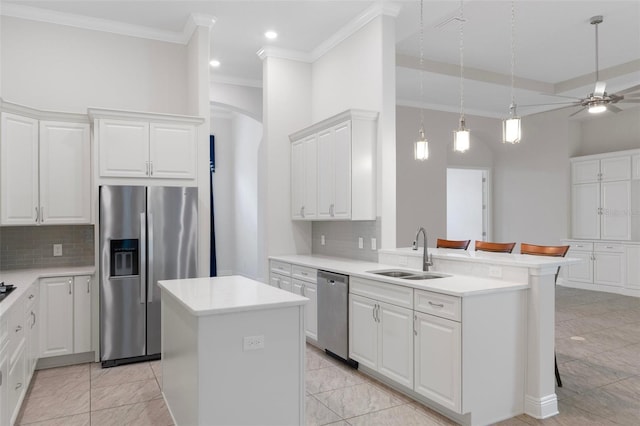 877 N Hunt Club Dr, Hernando, FL 34442 - kitchen featuring ceiling fan, white cabinetry, a kitchen island, appliances with stainless steel finishes, and a sink