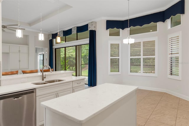 877 N Hunt Club Dr, Hernando, FL 34442 - kitchen featuring a tray ceiling, dishwasher, a sink, and white cabinets