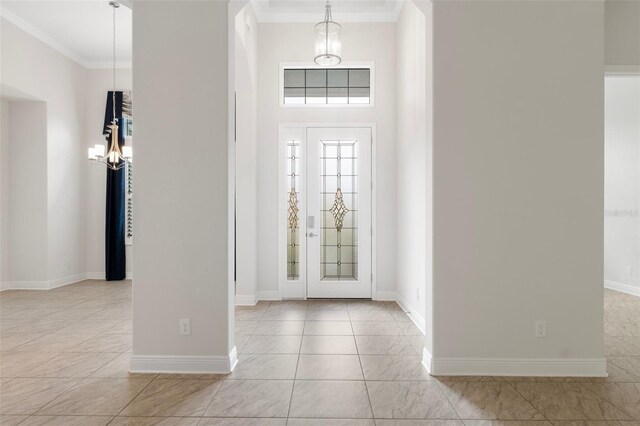 877 N Hunt Club Dr, Hernando, FL 34442 - foyer entrance featuring an inviting chandelier, baseboards, and crown molding