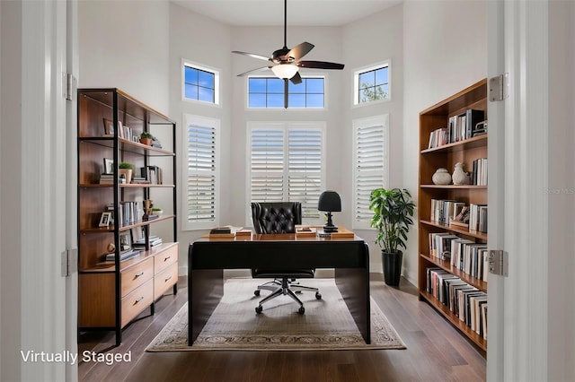 877 N Hunt Club Dr, Hernando, FL 34442 - home office featuring wood finished floors, ceiling fan, a towering ceiling, and baseboards