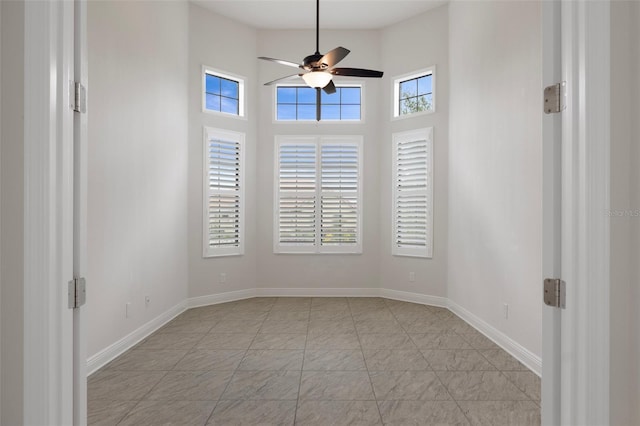 877 N Hunt Club Dr, Hernando, FL 34442 - spare room featuring a towering ceiling, baseboards, and ceiling fan