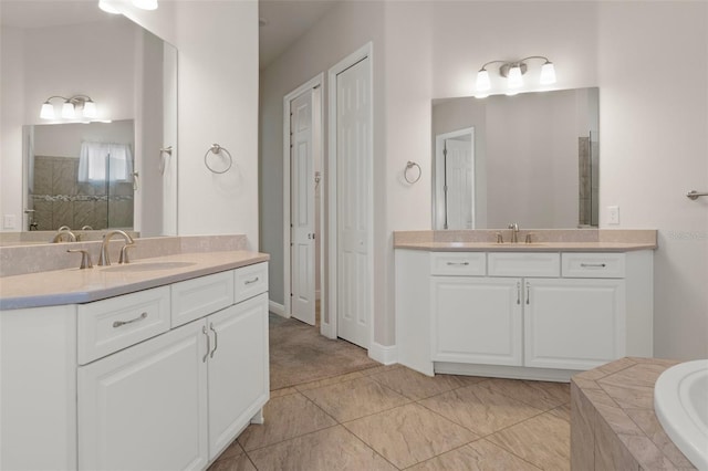 877 N Hunt Club Dr, Hernando, FL 34442 - bathroom featuring two vanities, tiled tub, a tile shower, and a sink