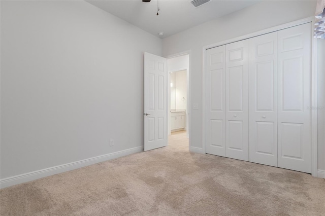 877 N Hunt Club Dr, Hernando, FL 34442 - unfurnished bedroom with a closet, baseboards, visible vents, a ceiling fan, and carpet floors