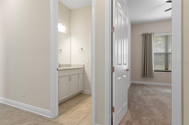 877 N Hunt Club Dr, Hernando, FL 34442 - bathroom with baseboards, a ceiling fan, and vanity