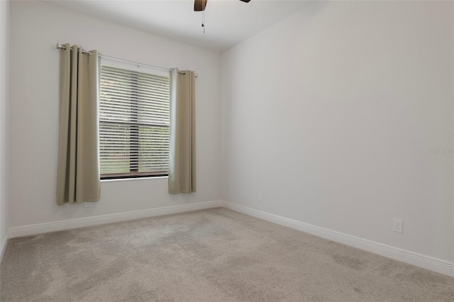 877 N Hunt Club Dr, Hernando, FL 34442 - spare room featuring carpet floors, baseboards, and a ceiling fan