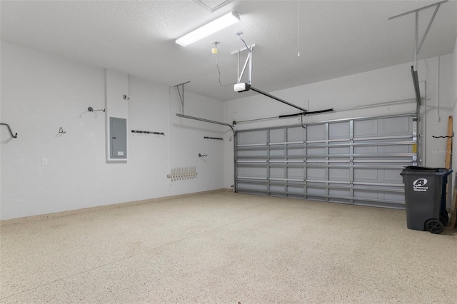 877 N Hunt Club Dr, Hernando, FL 34442 - garage featuring a garage door opener, baseboards, and electric panel