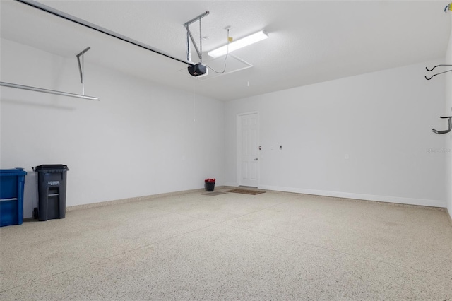 877 N Hunt Club Dr, Hernando, FL 34442 - garage with a garage door opener and baseboards