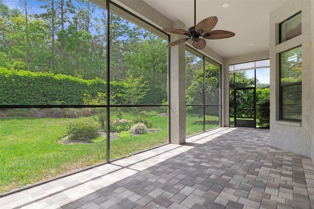 877 N Hunt Club Dr, Hernando, FL 34442 - unfurnished sunroom featuring a ceiling fan