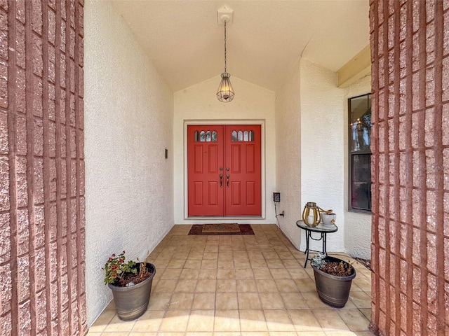 entrance to property with stucco siding