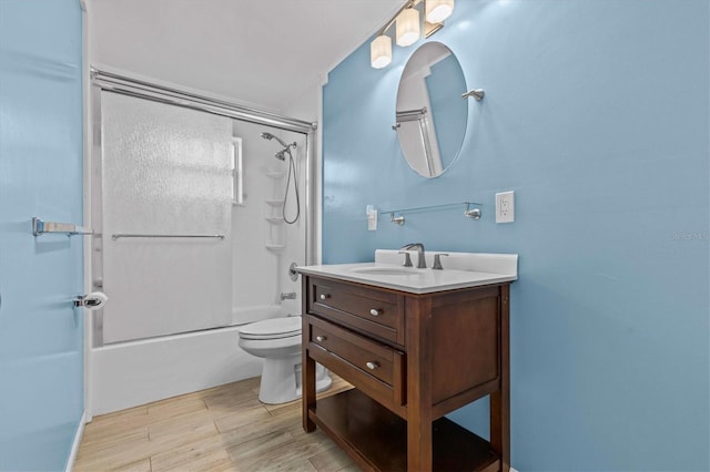 155 Patty Ann Blvd, Palm Harbor, FL 34683 - bathroom with toilet, shower / bathing tub combination, vanity, and wood finished floors