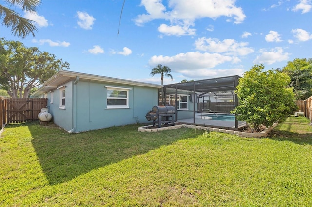 155 Patty Ann Blvd, Palm Harbor, FL 34683 - rear view of house featuring a fenced in pool, a fenced backyard, a lanai, and a lawn