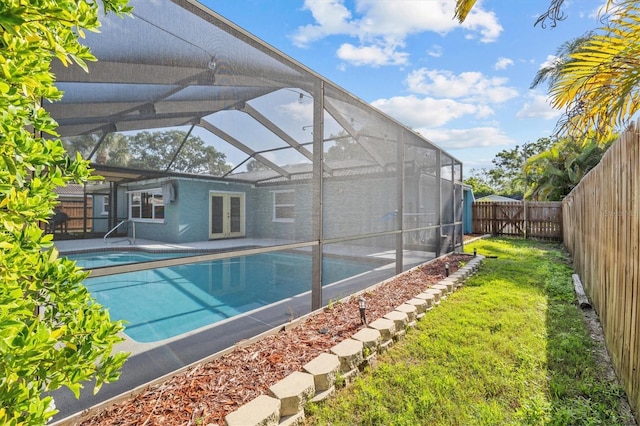 155 Patty Ann Blvd, Palm Harbor, FL 34683 - view of swimming pool with a fenced in pool, french doors, a patio area, a fenced backyard, and a lanai