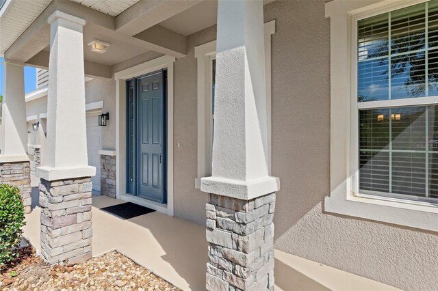 13619 Hunters Point St, Spring Hill, FL 34609 - property entrance with stucco siding and stone siding