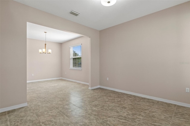 13619 Hunters Point St, Spring Hill, FL 34609 - unfurnished room featuring visible vents, baseboards, and an inviting chandelier