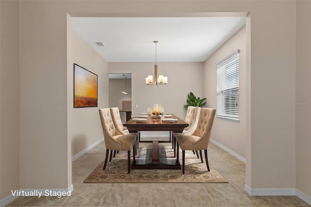 13619 Hunters Point St, Spring Hill, FL 34609 - dining area featuring an inviting chandelier, baseboards, and visible vents